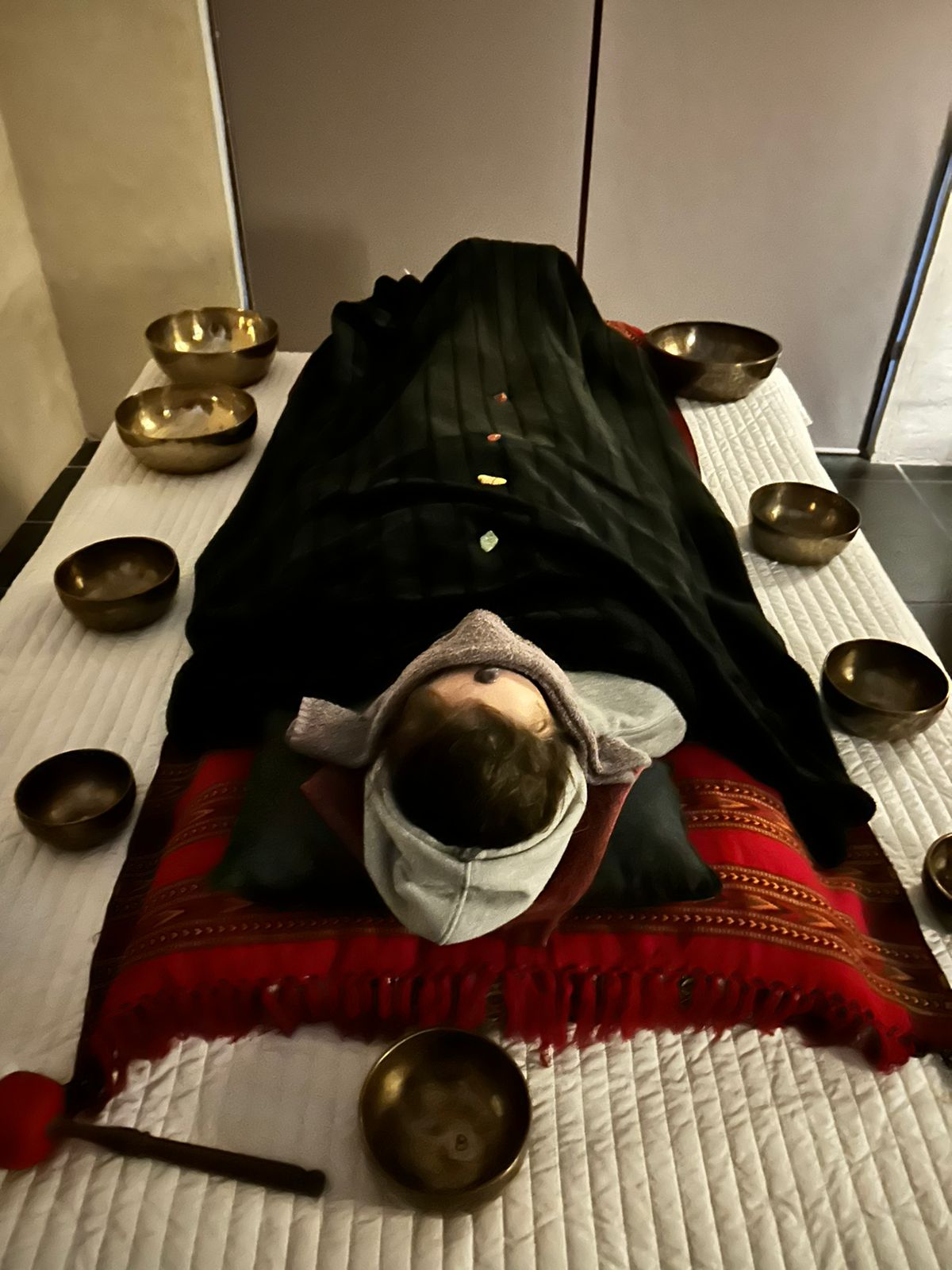 Client receiving Tibetan singing bowl therapy