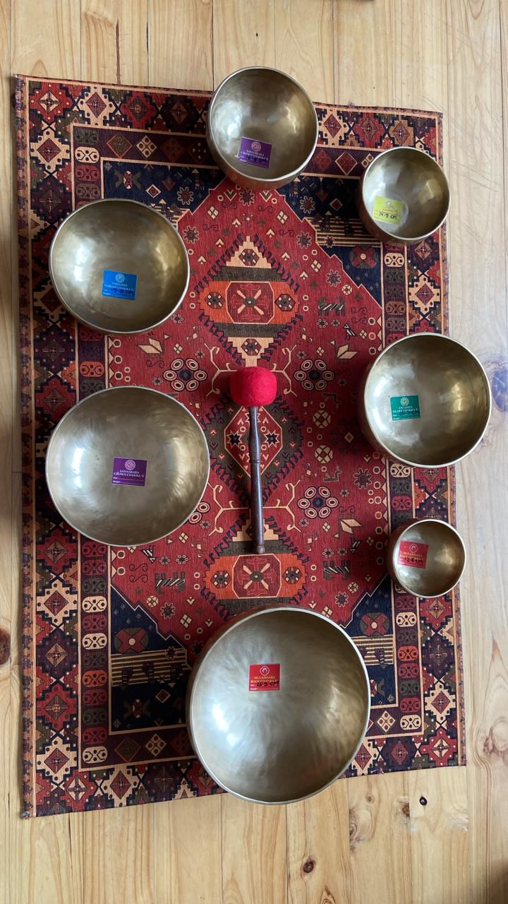 Tibetan singing bowl on mat outdoors