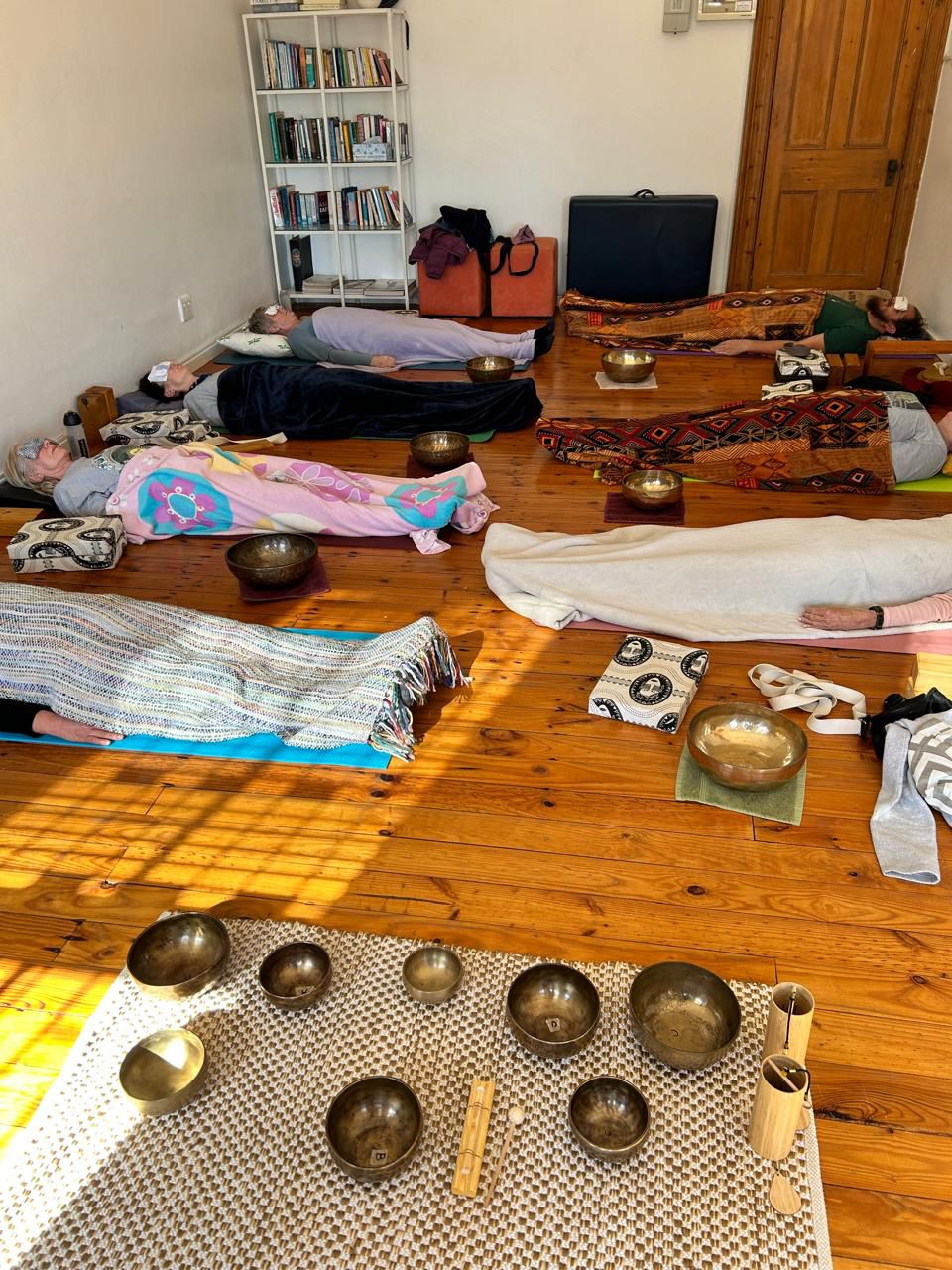 Tibetan singing bowls on the floor outdoors